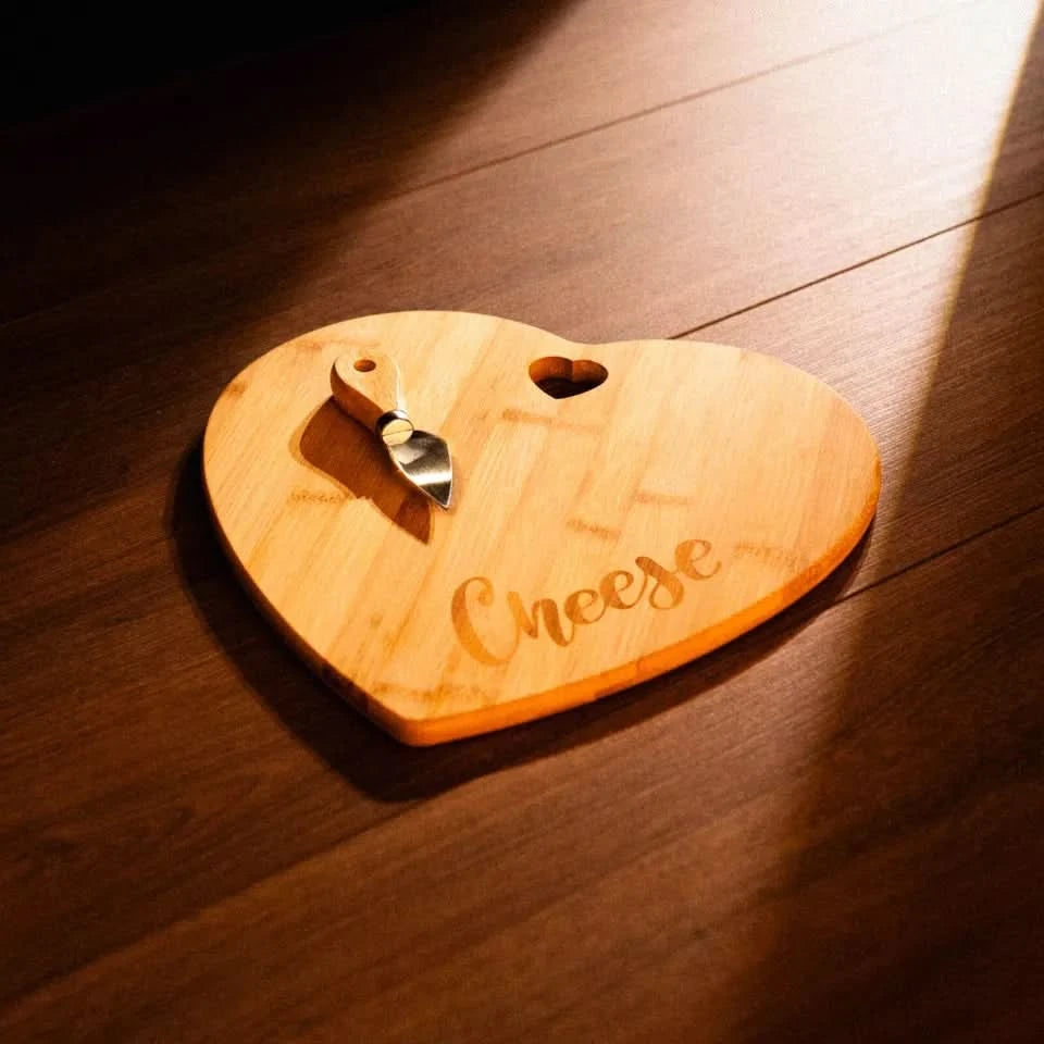Heart cheese board with knife